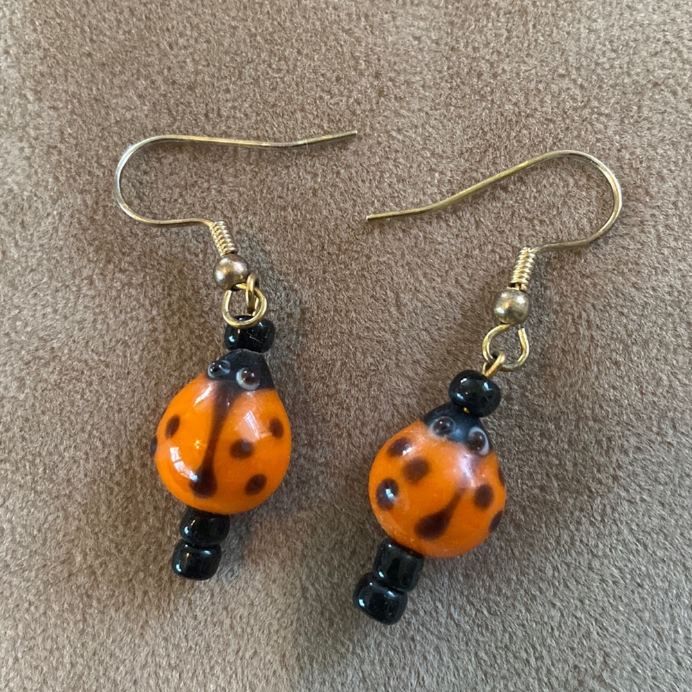 Glass bead lady bug dangling earrings